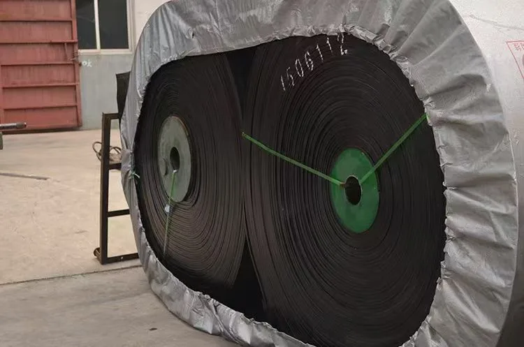 Wrapped rolls of black conveyor belting