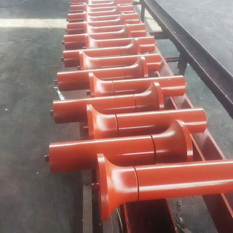 Red conveyor rollers arranged in rows
