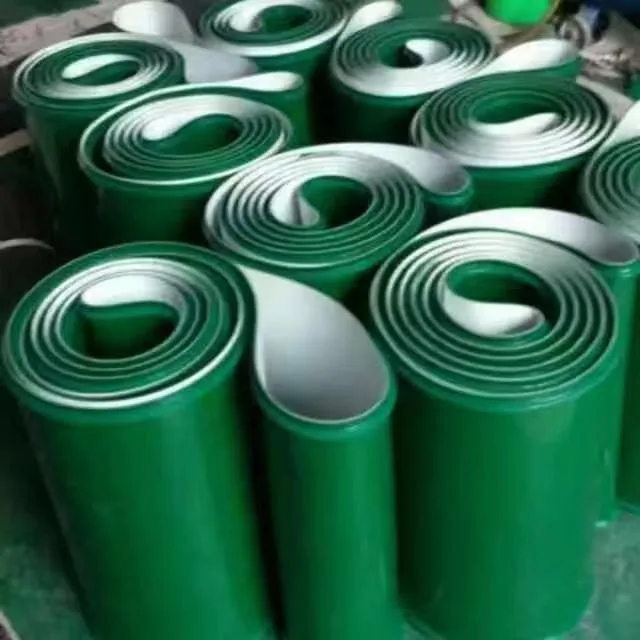Rolls of green belting with light-colored backing