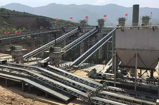Industrial material-handling plant with elevated belt conveyors